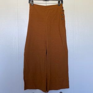 Brown/orange pants with leopard print buttons